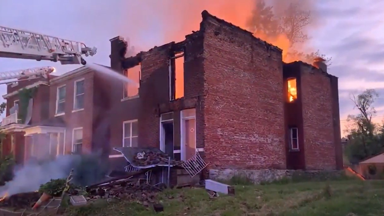 Two St. Louis firefighters injured in a partial building collapse during a structure fire Sunday.