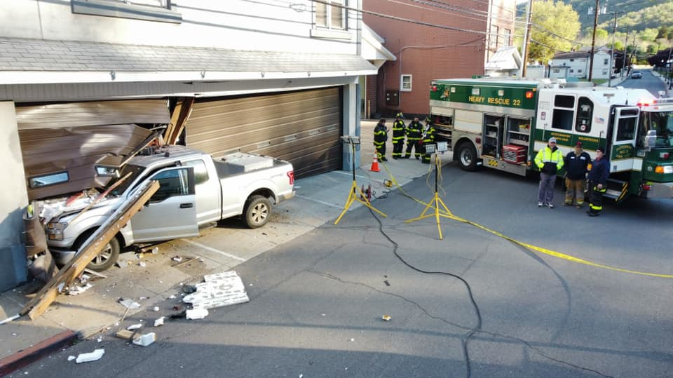 Two people were injured when the pickup truck they were in crashed into a the Tri-Towns EMS station in Westernport, MD, on Saturday.