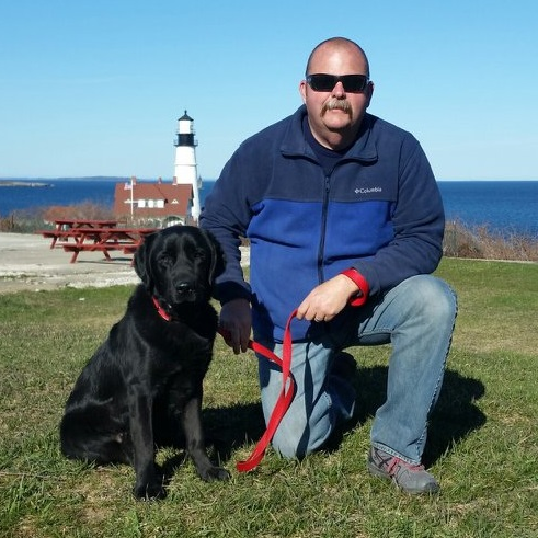 Sheldon and Saginaw, TX, Fire Department Battalion Chief John Tadlock, the dog's handler.