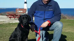 Sheldon and Saginaw, TX, Fire Department Battalion Chief John Tadlock, the dog's handler.