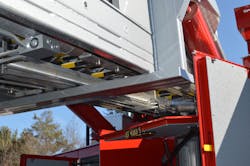 Hinged body compartment doors can be damaged by the aerial device during low-angle operations. Any area where cab or body interference could happen should be confirmed during final inspection.