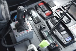 Joystick control of a wildland rig’s front-bumper monitor eliminates the potential for mishaps when a firefighter must ride on the extended front bumper to operate booster handlines. Joystick control of a wildland rig’s front-bumper monitor eliminates the potential for mishaps when a firefighter must ride on the extended front bumper to operate booster handlines.