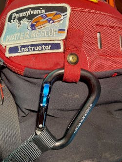 This snap loop is designed to release the carabiner when the triglide is deployed. Locking carabiners prevent the carabiner from clipping into objects, which prevents entrapment from happening. This snap loop is designed to release the carabiner when the triglide is deployed. Locking carabiners prevent the carabiner from clipping into objects, which prevents entrapment from happening.