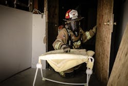 When opportunities are rare for rural firefighters to experience live fire training, fireground stressors should be omitted, so the firefighters can get the most out of the training. Subsequent trainings can incorporate stressors, such as a facepiece that has a smoke cover over it (shown here). When opportunities are rare for rural firefighters to experience live fire training, fireground stressors should be omitted, so the firefighters can get the most out of the training. Subsequent trainings can incorporate stressors, such as a facepiece that has a smoke cover over it (shown here).