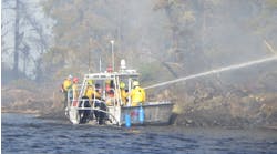 Firefighters from the International Falls Fire Department, together with the Minnesota Department of Natural Resources, responding to a wildfire on Rainy Lake&rsquo;s Frank Island. The fire, which jumped across open water to Voyageurs National Park on the mainland, was quickly extinguished despite high winds and elevated fire danger conditions.