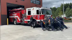 Clark-Cowlitz Fire Rescue firefighters push in a newly purchased apparatus to its Woodland, WA, station May 25, the first time the firehouse has received a new engine in 21 years. Clark-Cowlitz Fire Rescue firefighters push in a newly purchased apparatus to its Woodland, WA, station May 25, the first time the firehouse has received a new engine in 21 years.