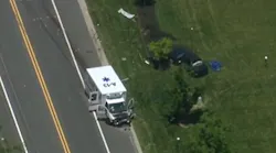 Two Claymont, DE, Fire Company EMS workers were injured when their ambulance collided with a car Wednesday, killing the 85-year-old driver of that vehicle.