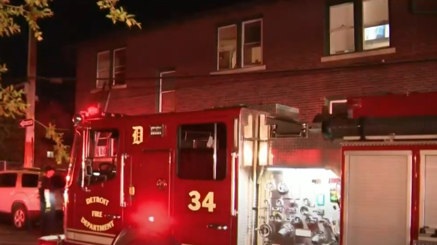 Detroit firefighters rescued a mother and three young children from a burning apartment building Wednesday.