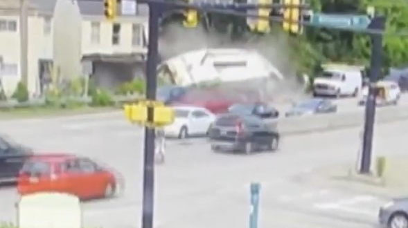 Etna, PA, firefighters created a makeshift wood shop at an accident scene to create support columns for a house after a garbage truck lost its brakes and sheered off the front before flipping on its side Tuesday.