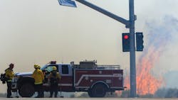 Firefighters battle the Farm Fire in Hesperia, CA, on Thursday.
