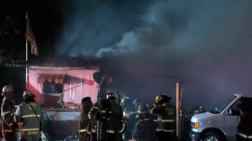 Firefighters from two departments stopped a fire from spreading throughout a Fresno, CA, mobile home community late Wednesday after flames destroyed two trailers and damaged at least two others.