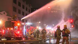 Over 100 Los Angeles firefighters battled an explosive fire at a 100-year-old downtown commercial building early Tuesday.