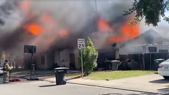 Firefighters narrowly escaped a 'catastrophic roof collapse' during a duplex fire in Modesto, CA, on Wednesday.