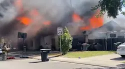 Firefighters narrowly escaped a 'catastrophic roof collapse' during a duplex fire in Modesto, CA, on Wednesday.
