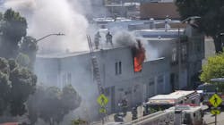 San Francisco firefighters rescued a critically injured person from the second floor of a burning building Monday.