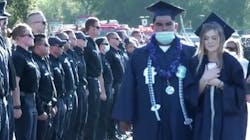 Hundreds of first responders line the graduation ceremony entrance Thursday to greet the daughter of Los Angeles County firefighter Tory Carlon, who was fatally shot by a colleague at the department&apos;s Agua Dulce station Tuesday.