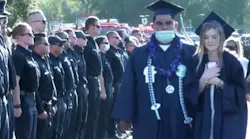 Hundreds of first responders line the graduation ceremony entrance Thursday to greet the daughter of Los Angeles County firefighter Tory Carlon, who was fatally shot by a colleague at the department's Agua Dulce station Tuesday.