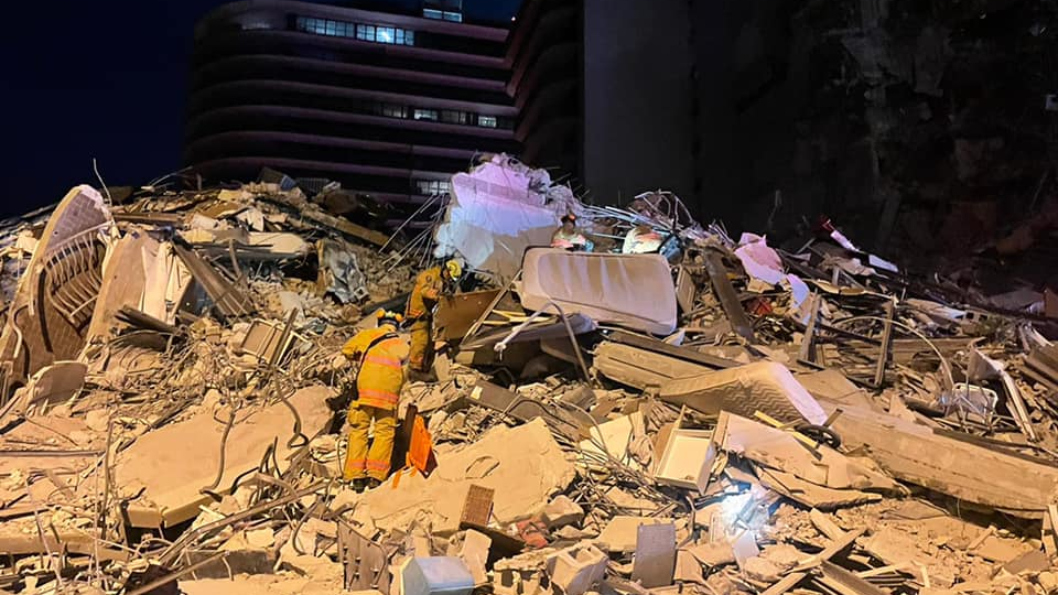 Miami-Dade firefighters search for survivors amid the rubble of a 12-story condo tower that partially collapsed in Surfside early Thursday.