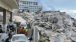 Rescue teams continue to search for survivors amid the rubble of the partially collapsed 12-story condo tower in Surfside, FL, on Friday.