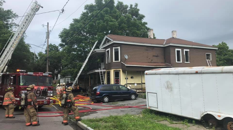 Roughly 30 Syracuse, NY, firefighters battled a fire that broke out at a vacant house Tuesday.