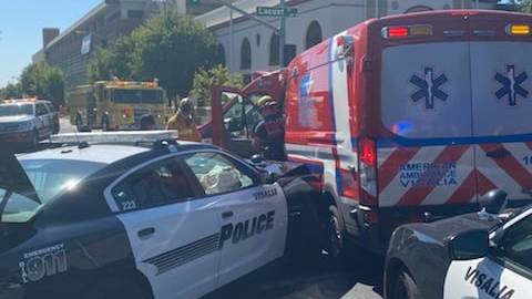 A woman is accused of stealing an American Ambulance unit and ramming another ambulance and injuring a police officer in Visalia, CA, on Monday.