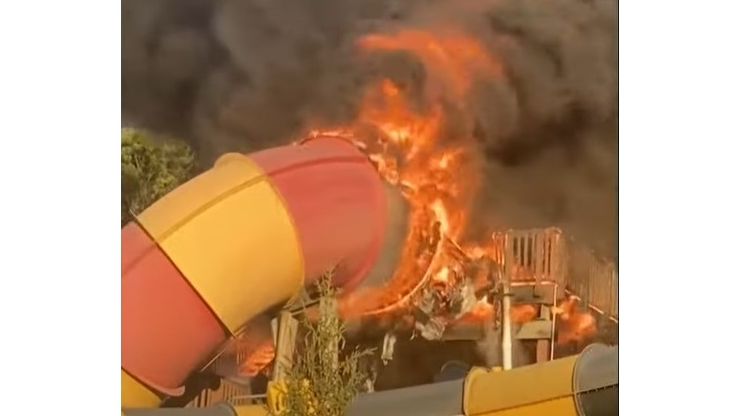 Vernon Township, NJ, firefighters battled a large fire that engulfed and heavily damaged a raft water slide at Mountain Creek Water Park on Tuesday.
