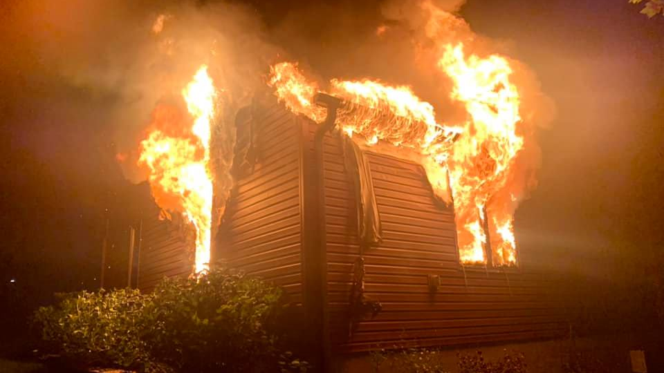 A Western Berks, PA, firefighter was rescued by fellow crew members when he partially fell through a first floor hole during a South Heidelberg Township house fire Sunday.