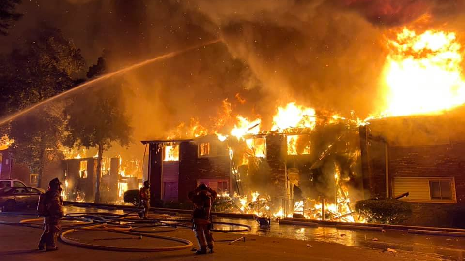 DeKalb County firefighters rescued one person who was asleep as flames engulfed the two-story building.