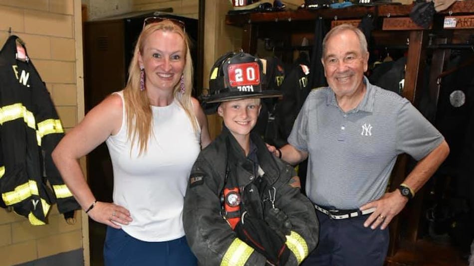 Retired FDNY firefighter Eugene Pugliese (right) with Deidre Taylor Saturday. Taylor and her mother was inside a burning apartment in 1983 when Pugliese rescued her.