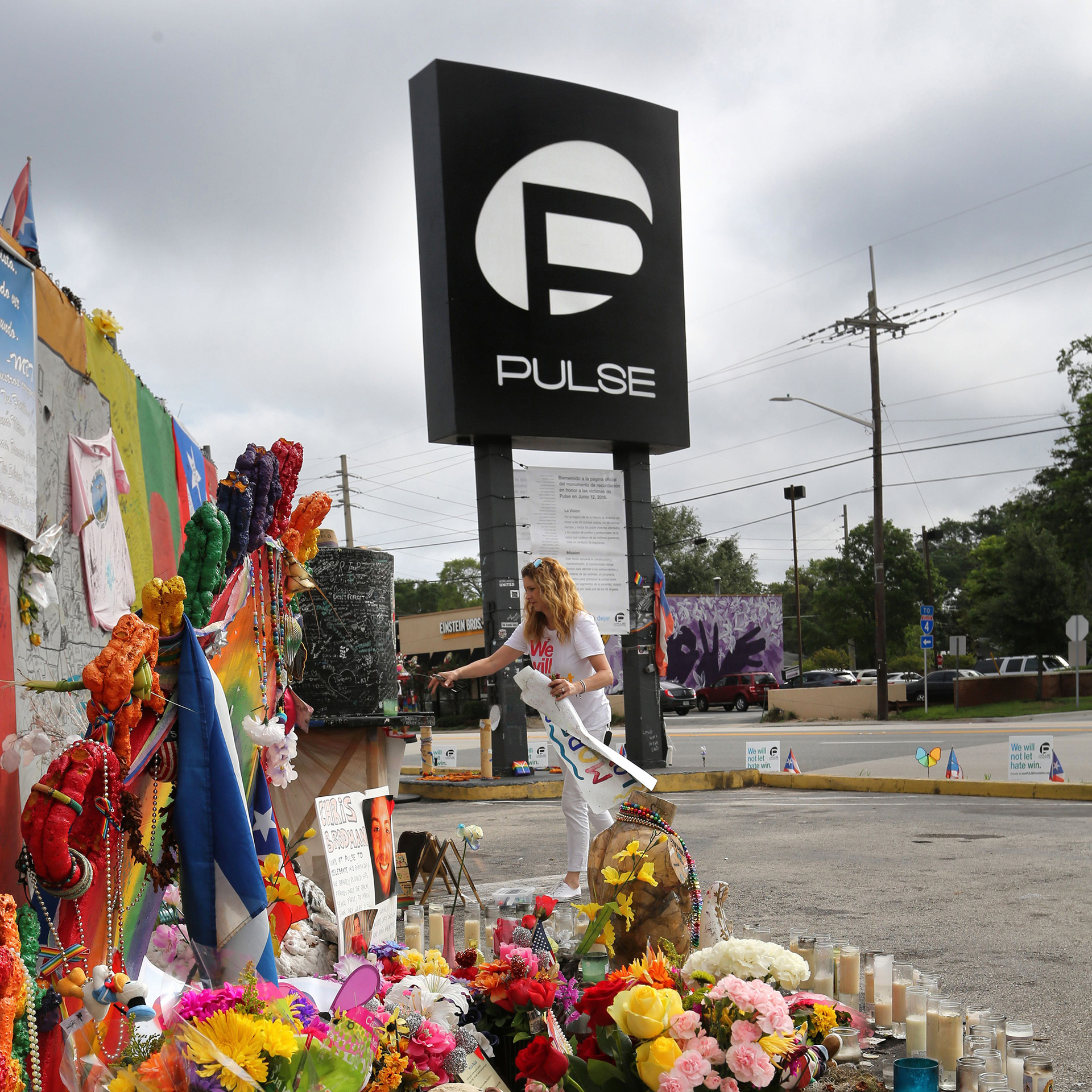 In this file photo, Pulse nightclub owner Barbara Poma tends to the memorial in front of her club on June 10, 2017, in Orlando, FL.