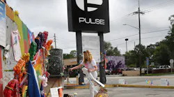 In this file photo, Pulse nightclub owner Barbara Poma tends to the memorial in front of her club on June 10, 2017, in Orlando, FL.