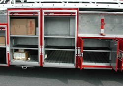 Figure 6. Side compartments that can be transversely open below the frame rails. Figure 6. Side compartments that can be transversely open below the frame rails.