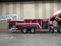 Figure 3. Because the aerial is stowed over the cab on this rear-mount aerial apparatus, the compartments can extend to the same height of the cab.