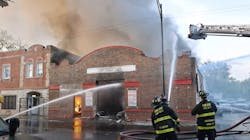 Chicago firefighters battled a three-alarm fire that broke out at an auto body shop in the city's Back of Yards neighborhood Sunday. Chicago firefighters battled a three-alarm fire that broke out at an auto body shop in the city's Back of Yards neighborhood Sunday.