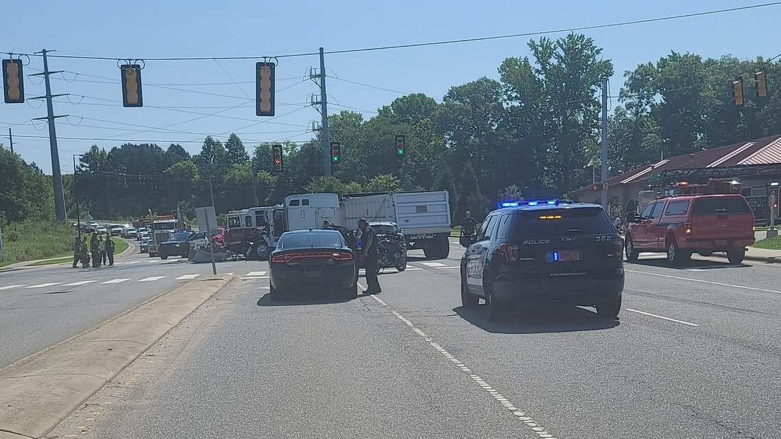 Four Concord, NC, firefighters were injured when their apparatus collided with a tractor-trailer while responding to a call Friday.