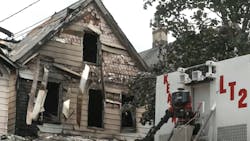 Two firefighters were injured battling a five-alarm fire that tore through three homes in Kearny, NJ, on Sunday. Two firefighters were injured battling a five-alarm fire that tore through three homes in Kearny, NJ, on Sunday.