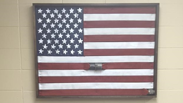 Napa, CA, firefighter Ryan Chagonjian has turned surplus hoselines into American flag artwork.