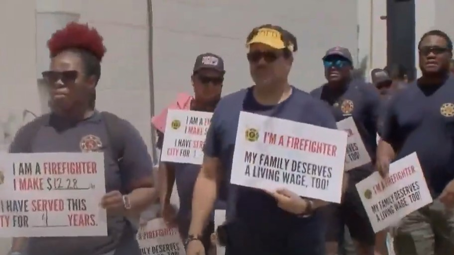 New Orleans firefighters march on City Hall on Thursday to ask to be paid a living wage for their work.