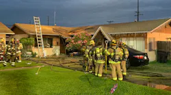 Orange County, CA, Fire Authority crews rescued an unconscious man from the bedroom of a burning duplex Sunday.