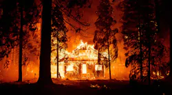 A home burns as flames from the Dixie Fire tear through the Indian Falls neighborhood of unincorporated Plumas County, CA, on July 24, 2021.