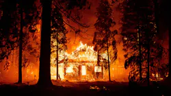 A home burns as flames from the Dixie Fire tear through the Indian Falls neighborhood of unincorporated Plumas County, CA, on July 24, 2021.