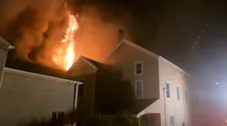 A firefighter suffered a knee injury while battling a fire that started in a vacant building in Vandergrift and spread to two neighboring structures late Monday.