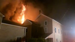 A firefighter suffered a knee injury while battling a fire that started in a vacant building in Vandergrift and spread to two neighboring structures late Monday.