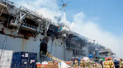 Firefighters stage their response alongside the USS Bonhomme Richard, which burned for four days in July 2020 in San Diego.