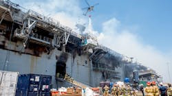 Firefighters stage their response alongside the USS Bonhomme Richard, which burned for four days in July 2020 in San Diego. Firefighters stage their response alongside the USS Bonhomme Richard, which burned for four days in July 2020 in San Diego.