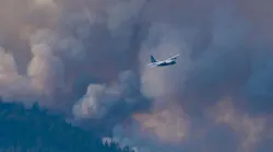 An Air National Guard C-130 helps fight the Beckwourth Complex Fire in Plumas County, CA, on July 12, 2021.