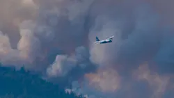 An Air National Guard C-130 helps fight the Beckwourth Complex Fire in Plumas County, CA, on July 12, 2021.