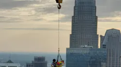 A Charlotte, NC, firefighter rescues a construction worker who was injured on the 40th floor of a skyscraper Thursday.