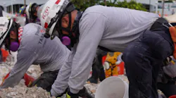Rescue workers from task forces around the world, including Miami-Dade Fire Rescue and Israel, dig through the rubble of the collapse condo tower in Surfside, FL, on Tuesday.