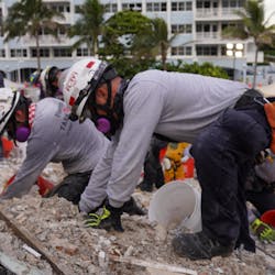 Rescue workers from task forces around the world, including Miami-Dade Fire Rescue and Israel, dig through the rubble of the collapse condo tower in Surfside, FL, on Tuesday. Rescue workers from task forces around the world, including Miami-Dade Fire Rescue and Israel, dig through the rubble of the collapse condo tower in Surfside, FL, on Tuesday.